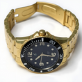 Load image into Gallery viewer, Gold watch with black dial on a white background
