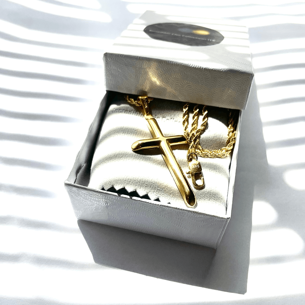 Gold-filled rope chain necklace with cross pendant in a gift box, showcasing luxurious design and craftsmanship.
