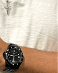 Load image into Gallery viewer, Man wearing ICC Dive Watch in black carbon with a matte finish, featuring a durable design and iconic Michael Sword symbol.
