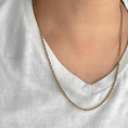 Load image into Gallery viewer, 24K gold filled rope chain necklace displayed on a person wearing a white V-neck shirt.
