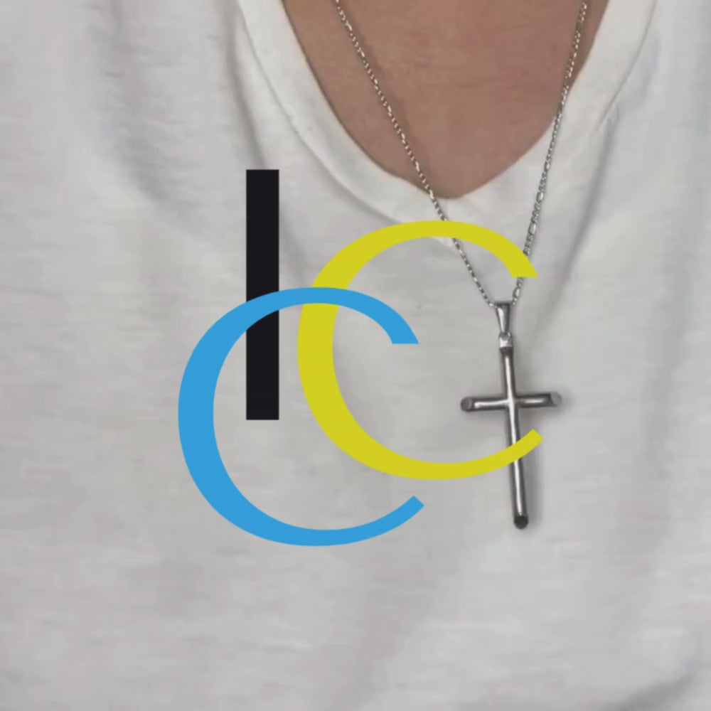 Video of Man wearing 14k gold-plated cross pendant necklace with Figaro chain, handcrafted and tarnish-resistant, 22 inches long.