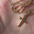 Load and play video in Gallery viewer, 24K gold-filled rope chain necklace featuring a small cross pendant, showcasing premium craftsmanship and elegant design.
