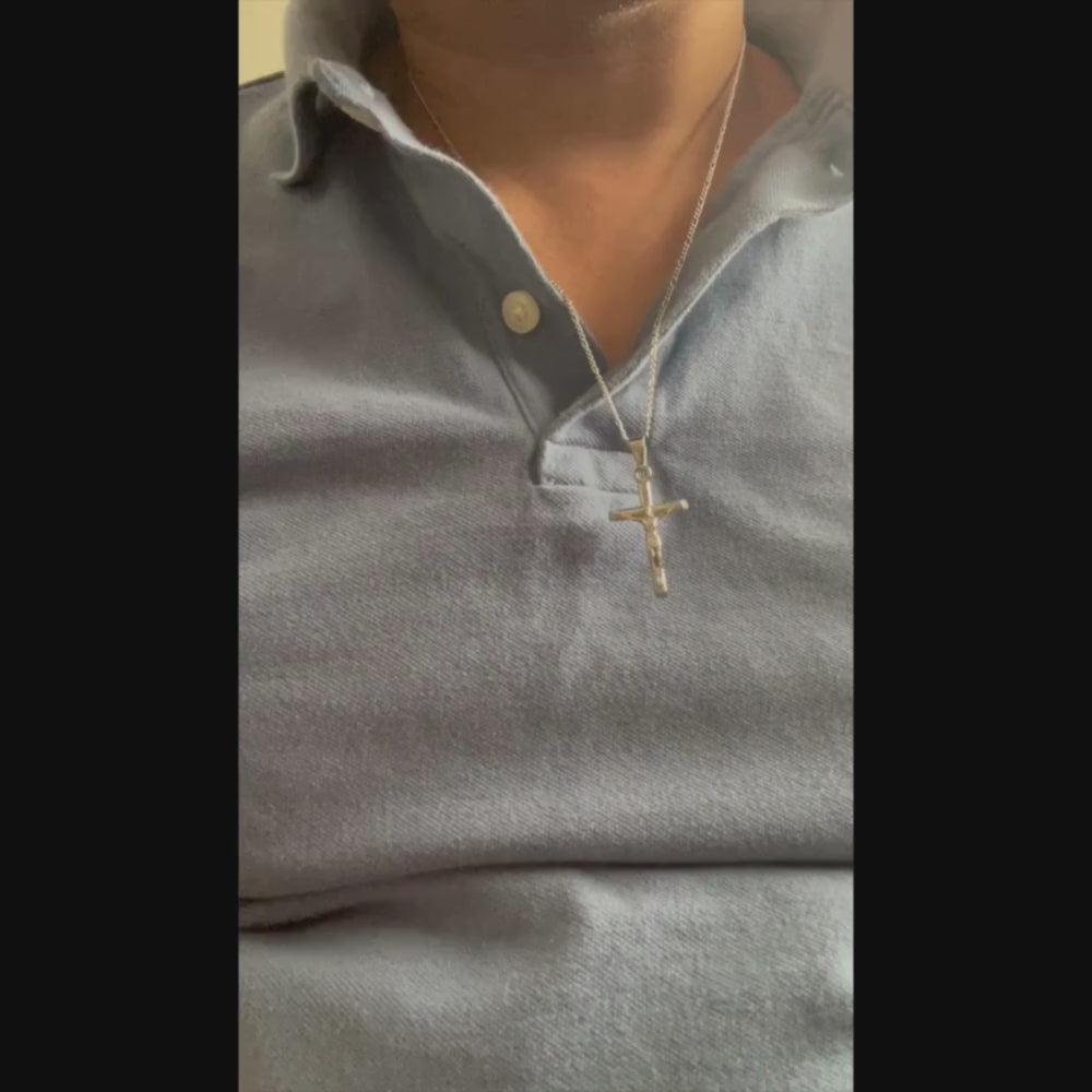 Man Wearing 14k white gold crucifix necklace for men and women, showcasing a stunning cross pendant on a delicate chain.