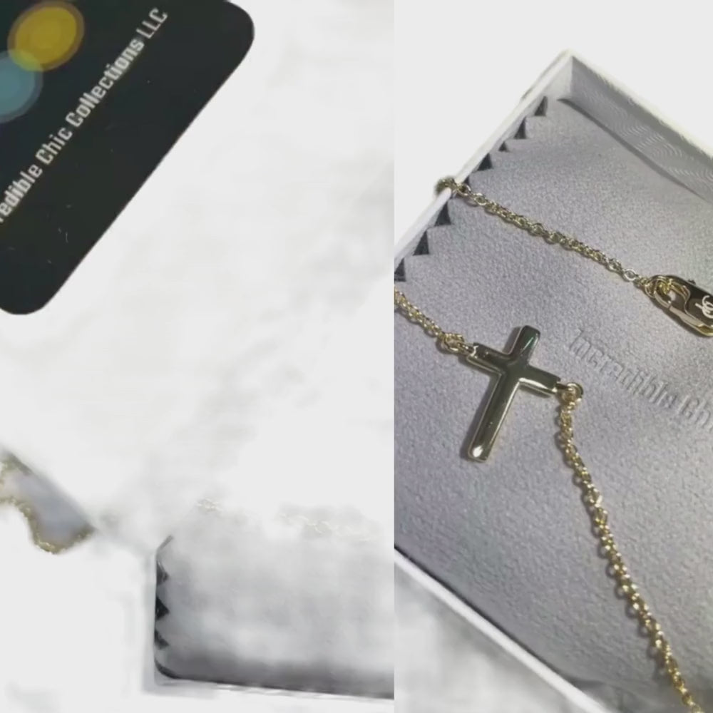 Incredible Chic 14k gold cross necklace displayed in gift box, perfect for layering and everyday wear.
