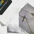 Load and play video in Gallery viewer, 14k gold cross necklace displayed in elegant packaging, perfect for layering and as a gift for special occasions.
