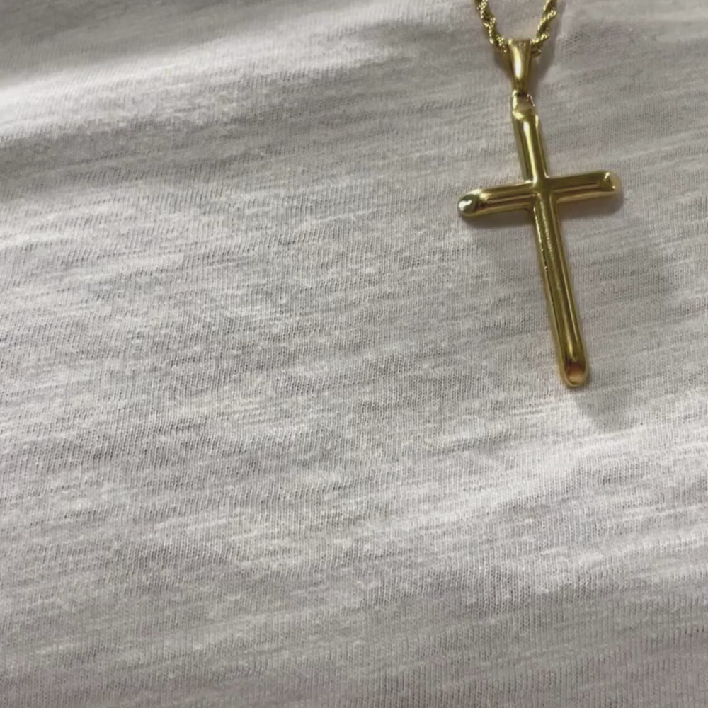 Video of Man Wearing Gold-filled rope chain necklace with cross pendant in a gift box, showcasing luxurious design and craftsmanship.