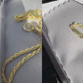 Load and play video in Gallery viewer, 10K solid yellow gold diamond-cut rope chain necklace with lobster clasp, displayed on a soft background.
