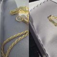 Load and play video in Gallery viewer, 10K solid yellow gold diamond-cut rope chain necklace with lobster clasp in jewelry display.
